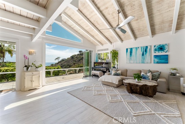 Living Room open to the ocean view patio