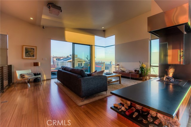 Glass fireplace off living room and dining area