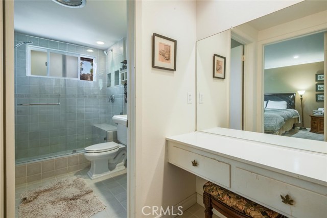 Master Bath with tile upgrades and a sitting area vanity.