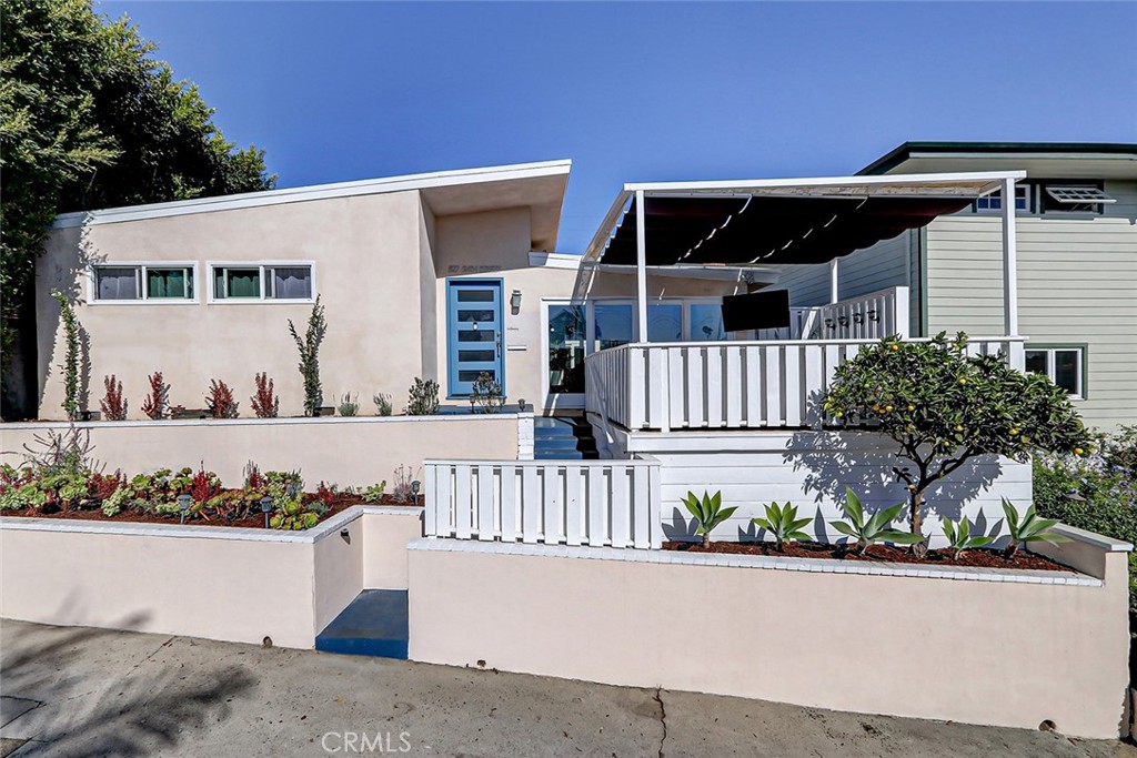 RE-launched and reduced:  A classic & spacious ONE LEVEL beach home with style perfectly situated in the highly sought-after 'Gas Lamp' district of the Manhattan Beach Sand Section  This beautiful Mid-Century Bungalow single-family home sits on a rare lot and a half (45' wide vs. the standard 30'). Built for quiet family life and entertaining, this four-bedroom has a great flow and lives much larger than the sq. ft. may suggest.  The layout includes a wonderful primary suite with a newer bathroom and walk-in closet. The extra width and south-facing property orientation flood the home with natural light and offers a sneaky good view of the Tree Section and city lights below. Standout features include slightly vaulted white wood ceilings, a NEW KITCHEN, new floors, a large, sunny, private front deck off the living room and a spacious courtyard - perfect for outdoor dining and good times after a day at the beach. The two-car garage opens to a quiet, cul-de-sac-like alley providing easy access to award-winning Grandview Elementary School. Just a few blocks from one of California's most beautiful beaches and a short stroll to the shops and restaurants of famous downtown Manhattan Beach. This home offers the best of both the Tree Section and the Sand Section. You must see it to feel it—527 24th Street is truly special!