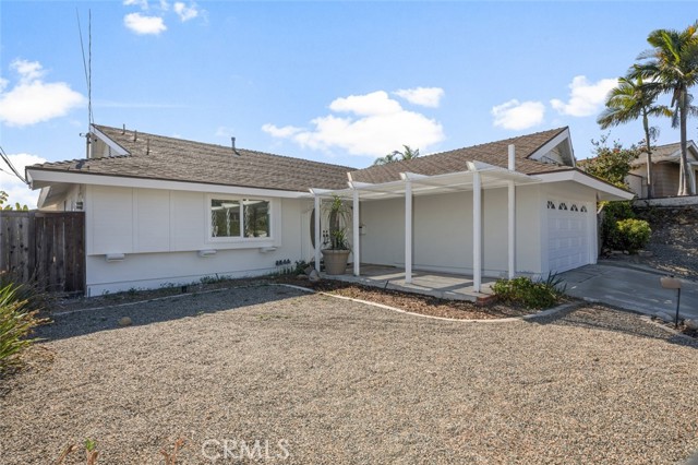 Low maintenance front yard with a peaceful sitting area.