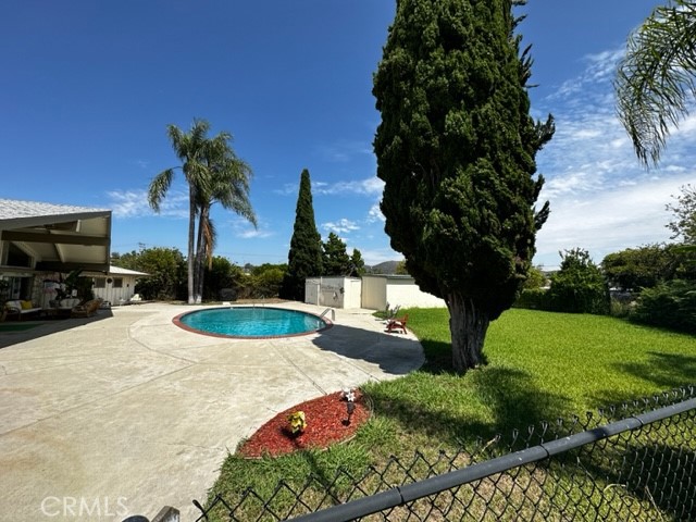 Private community pool, BBQ, and clubhouse area