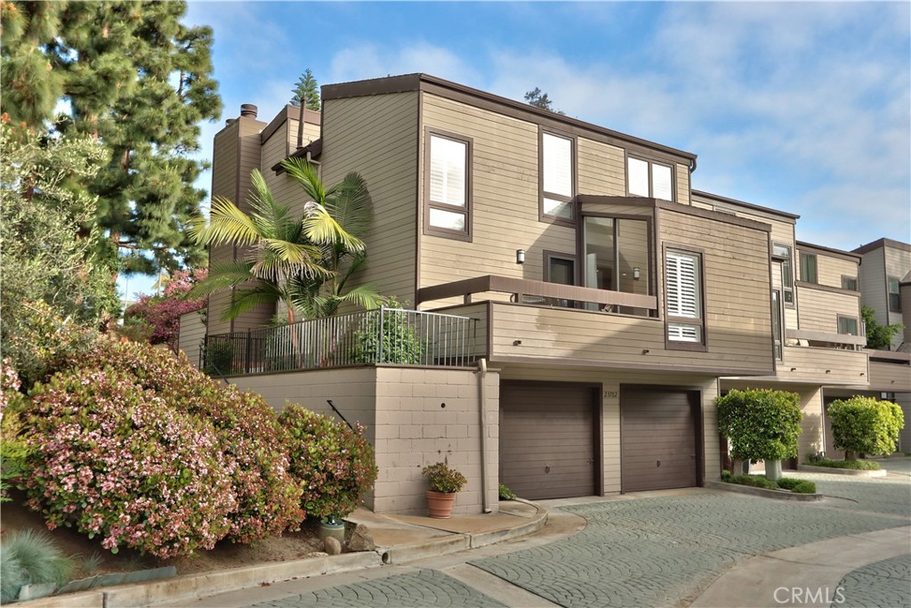 Beautifully updated and spacious townhome located in South Laguna Niguel. Its location is particularly advantageous, being just minutes away from Monarch Beach, Salt Creek, and Dana Point Harbor. The property boasts several attractive features, including its end-unit location, which provides an abundance of natural light through numerous windows. The main level offers an open layout enhanced by wood-look tile flooring, encompassing an enclosed patio and balcony, a family room, a dining room, a kitchen, and a half bathroom. Furthermore, the kitchen has been completely remodeled with granite countertops, a natural stone backsplash, new soft-close cabinets including a lazy susan, and stainless steel appliances. Upstairs, you will find two generously sized bedrooms and two fully remodeled bathrooms with walk-in showers. The primary bedroom is equipped with a fireplace, and its en-suite bathroom has been similarly renovated to include a stunning walk-in shower. The exterior grounds are characterized by a lush, tropical, woodsy ambiance. New Reduced Price to Sell. Sellers are MOTIVATED Arrange a showing today!