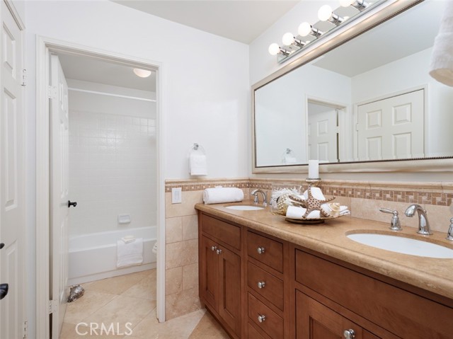 Jack & Jill Bathroom with Double Sinks and Separate Tub Area