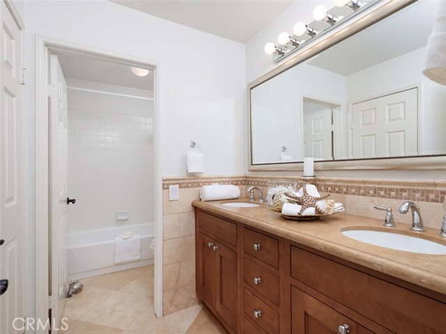 Jack & Jill Bathroom with Double Sinks and Separate Tub Area