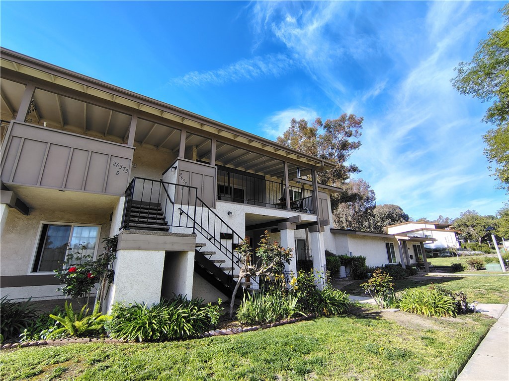 Take in the views, this up stairs condo has a spacious balcony with spectacular views. Relax amongst the mature trees throughout the community. Two beds, one bath, new carpet in bedrooms, newer vinyl flooring in living area, tile throughout the kitchen, double pane windows, updated bathroom and spacious kitchen. Carport with spaces for 2 cars with secure storage, laundry room down stairs, RV storage available.  Safe community, pet friendly with lots of activities, on site 9 hole golf course, additional chipping practice areas, big swimming pool, hot tub, library, performance center and meeting hall, wood working shop, shuffle board, relax in a lodge setting or under a majestic California oak tree. This property offers serenity and tranquility, truly a gem.