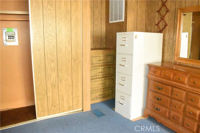 2nd bedroom-built in drawers behind filing cabinet