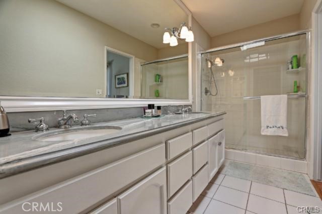 1st Master Suite Bath Upgraded and with Italian Marble Slab Stone Counters, Skylight & framed wall mirror, separate WC area