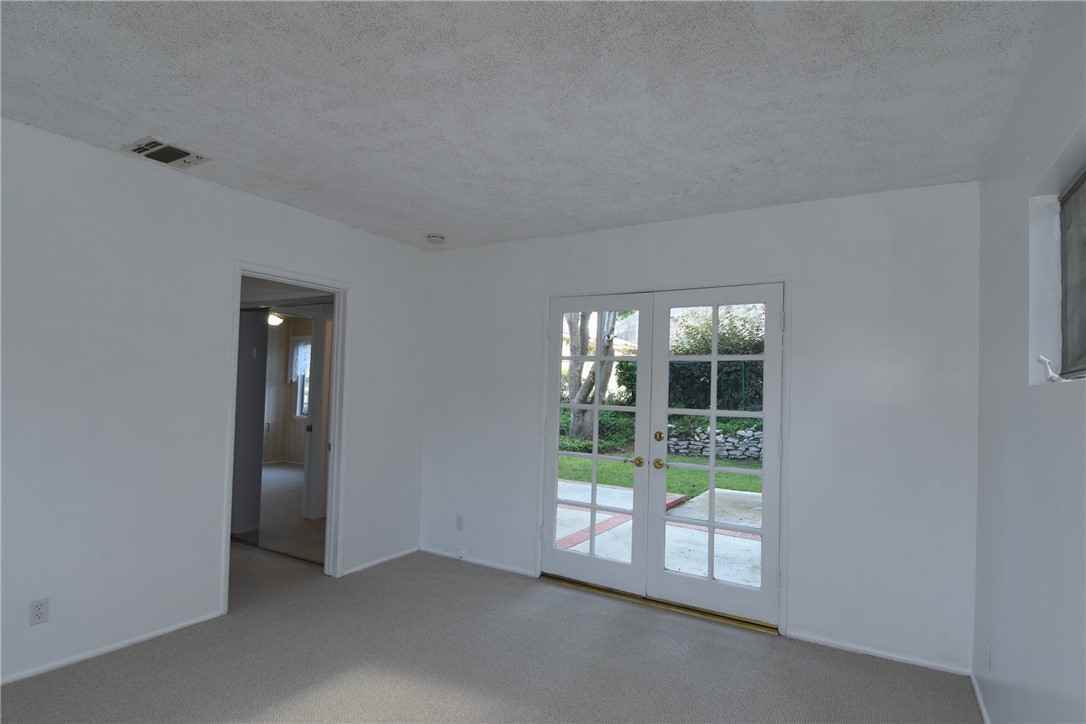 Bedroom #3 with French doors to yard!