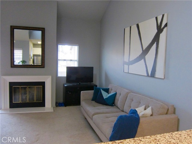 Looking out from the kitchen to the living room with gas fireplace!