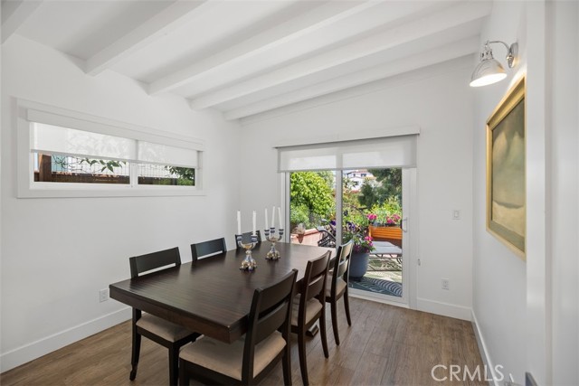 Second bedroom is currently used as a separate dining room. Slider opens to the lush backyard and the bedroom has mirrored closet doors.
