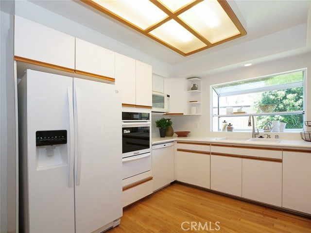 Another view of the kitchen with its garden window and new oven.