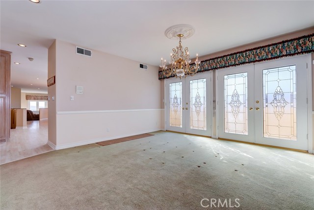 Formal dining room leads to very large kitchen and ocean view family room with a custom gas  fireplace.