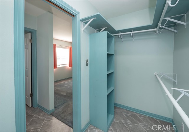 Walk in closet with built in shelves