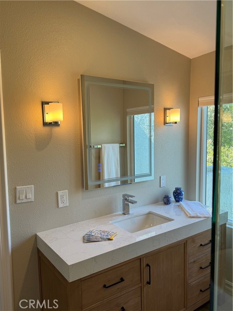 primary bath vanity with mirror.