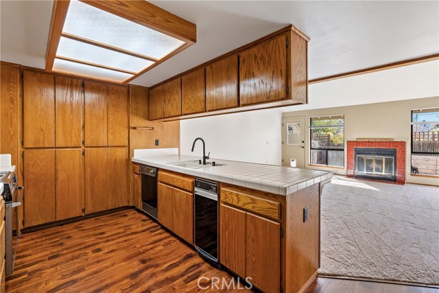 The kitchen is the center of the home and has ample cabinetry and countertop space making it ideal for meal prep.