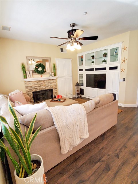 Family room with fireplace and built-in entertainment center.