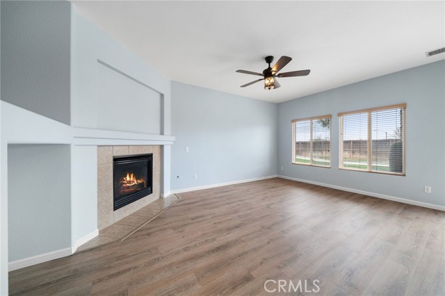 Super large family room with cozy gas fireplace leads to the backyard