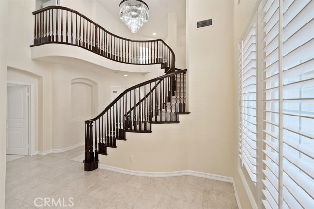 Formal entry with sweeping staircase