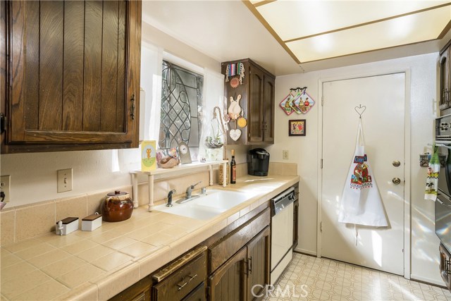 Galley kitchen with direct access to garage, making it super convenient after grocery shopping!