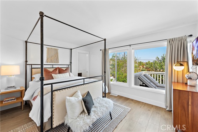 Additional view of upstairs secondary bedroom featuring a Queen size bed and ensuite bathroom and peek a pool ocean views.