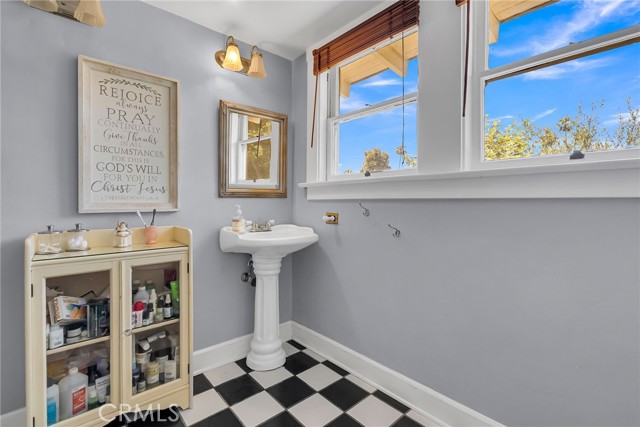 Upstairs bathroom has a shower and extra large closet space.