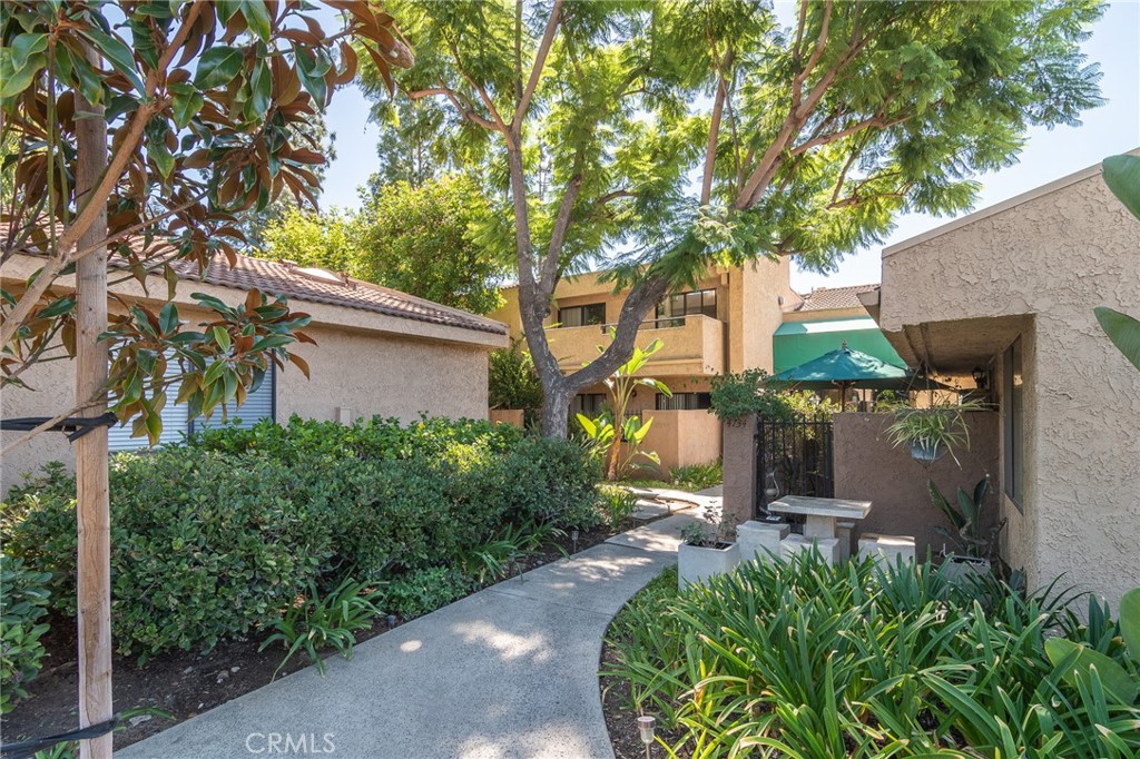 Community features lush landscaping and walkways