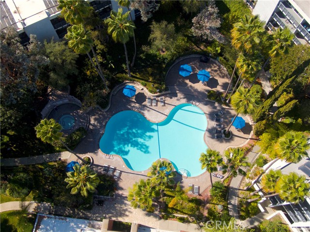 Resort style pool/spa with barbecue and seating area