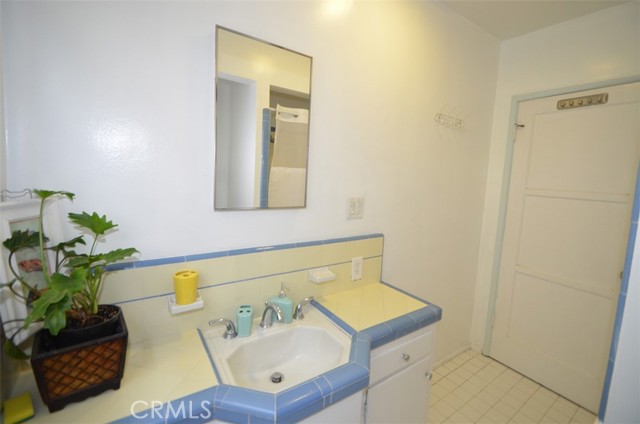 Vintage bathroom complete with a tub/shower combination. So 1940's!