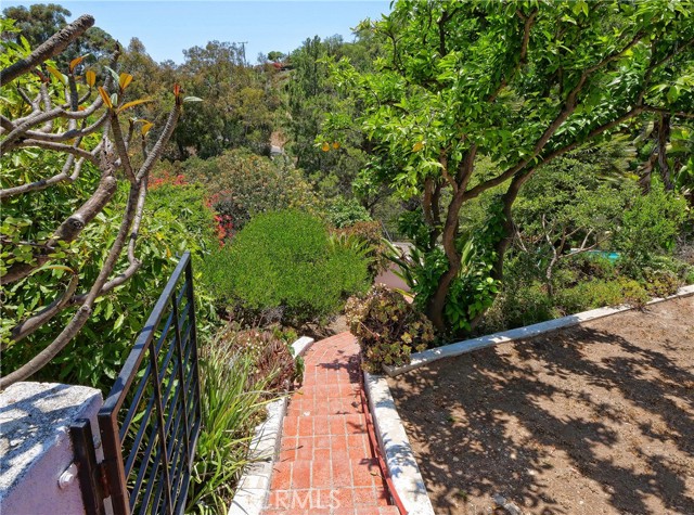 Steps leading to very private pool. jacuzzi and gazebo