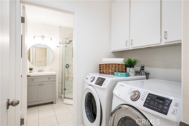 Upstairs laundry area includes the washer and dryer.