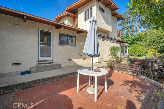 Another view of the patio and entrance to the home through the kitchen door