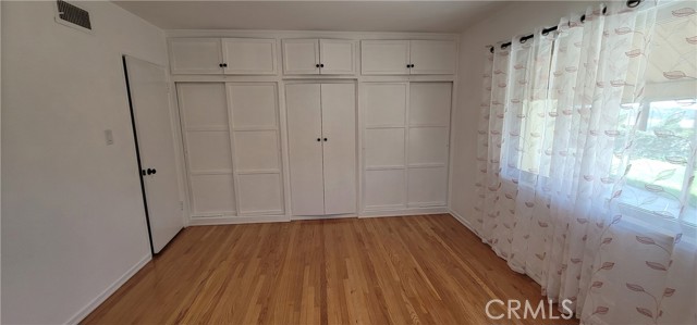 Primary bedroom featuring closets.