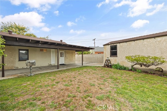 view of additional covered space next to garage