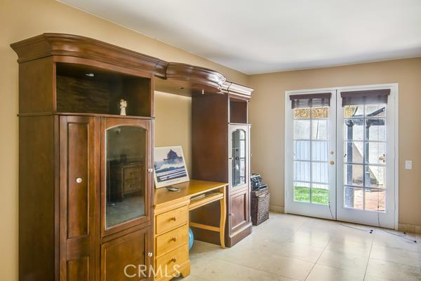 Office which has French doors leading to the outside patio area with pool, hot tub, and bar-be-que