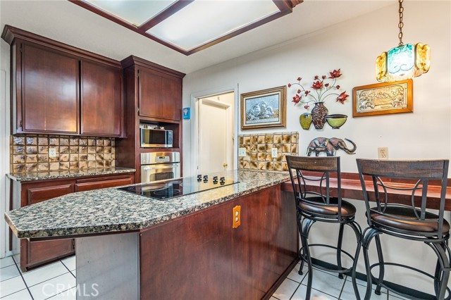 Kitchen showing breakfast bar.