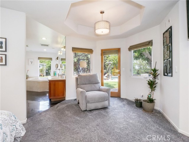 Door in Master Bedroom Leads to Backyard