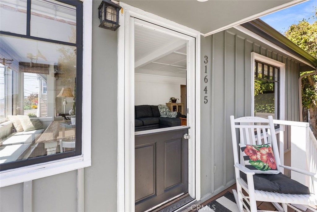 Welcome to 31645 2nd Avenue, a charming coastal retreat nestled in the heart of South Laguna
Village. This beautifully remodeled 3-bedroom, 3-bathroom home offers 1,618 square feet of
living space on a generous corner lot. Originally built in 1933, the residence seamlessly blends
historic character with modern upgrades. As you approach the front door, take a moment to enjoy
the ocean views from your own private entry deck. Inside, the spacious family room features
newer wood flooring, custom paneling, and a beautiful fireplace, creating a warm and inviting
atmosphere. The redesigned kitchen is accented by custom cabinets, a pantry, and beautiful
quartz countertops. Off the kitchen, an oversized private backyard provides ample space for
entertaining, gardening, or simply enjoying the California sun. The upper level includes two
bedrooms and two completely remodeled bathrooms. Downstairs, a private lower level with a
separate entry offers a spacious studio or partitioned one-bedroom guest suite with its own
bathroom and kitchen—ideal for guests or rental income. Located just minutes from the sand, this
home is centrally positioned near world-renowned Thousand Steps and Table Rock beaches,
award-winning restaurants, shops, and the trolley to downtown Laguna Beach. Additional
features include a private brick patio, lush landscaping, and parking for up to four vehicles—a
rare find in this area. Experience the perfect blend of history and lifestyle at this unique South
Laguna property.