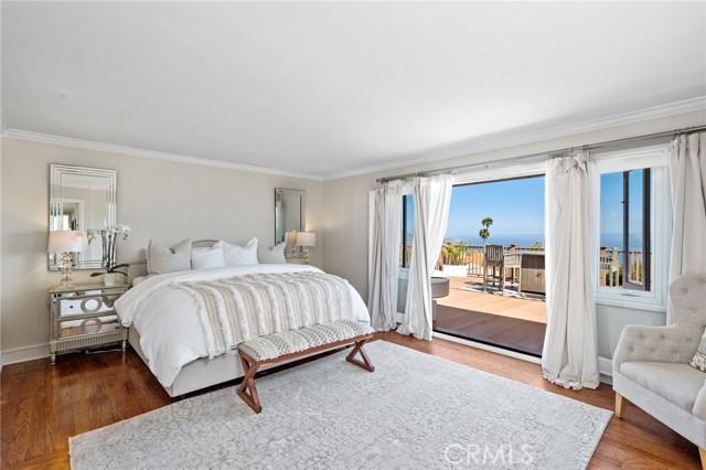 Escape to the master suite upstairs, where French doors open to a massive Trex sun deck. Here, you'll be captivated by jaw-dropping views of Catalina Island.