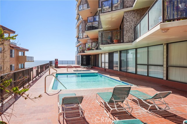 The Pool Deck has Tabels, Chairs, Loungers With Ocean Views and Breezes