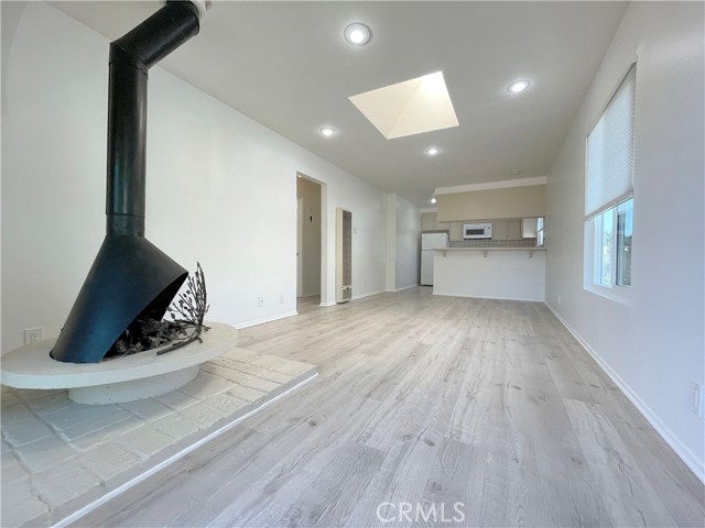 621 Begonia Avenue 1/2 Corona del Mar, California Walkthrough video available on our website (thebrandpm). Located on the ocean side of PCH, this two bedroom apartment with den is quintessentially the Corona Del Mar lifestyle you've been waiting for. You're literally a stones throw away from all the shops, cafe's, dining CDM has to offer. Cross the street and you're at the footstep of Fashion Island. Enjoy brunch at Rogers Garden less then a block away or go west to Begonia Park, sit on the bench and have your morning coffee staring away at Balboa Peninsula and beyond. Nestled in a pride-of-ownership neighborhood with single family homes all around, this upper unit apartment features an open & airy living room with an abundance of daylight from the skylight. The walls and vinyl plank flooring are in a neutral slated tone. An original mid-century (working) black fire-place stands in the corner as a statement piece. All new vinyl windows & slider through-out the apartment. The two bedrooms have new carpet and mirrored closet doors. A bathroom with a tile shower separates the two bedrooms. Owner provides a refrigerator, microwave & dishwasher here in the apartment. Walk down the steps again & around the corner of the garage and you'll see a gated private entry that leads you to the "den". The den is to be used as a home office or for storage only and will be enforced. The den has its own shower, toilet, sink, closet, (the electric range/oven will be removed prior to tenancy), there will be no cooking or living in the den. (Please read below about the den). One parking space is available in front of the single garage door (where the motorcycle is parked now) there is plenty of street parking available around the neighborhood. A stackable washer & dryer unit is next to the entry door next to the den. Please watch the video below for a quick walkthrough of the apartment & den. Thanks for looking! The den is "NOT" permitted for living. Although it has a shower, a toilet, this space is "strictly permitted for a home office or storage by the City of Newport Beach." (Violations will result in tenant restitution in city fines & could/will lead to eviction.)