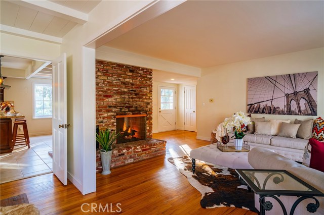 View of the living room, into the kitchen/family room from the dining room.