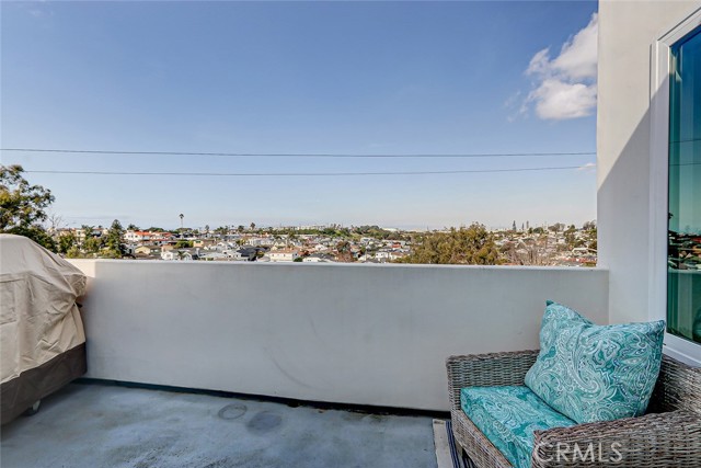 Just off of the living room catch tree top views and ocean peeks while BBQing with friends and family.