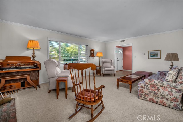 Another view of the living room with a large picture window