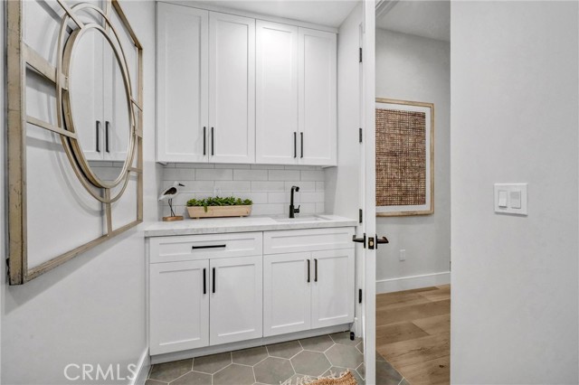 1ST LEVEL LAUNDRY ROOM WITH SINK-COUNTER