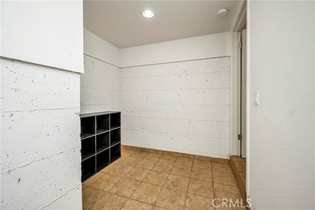 Wine cellar or storage room off garage entry.