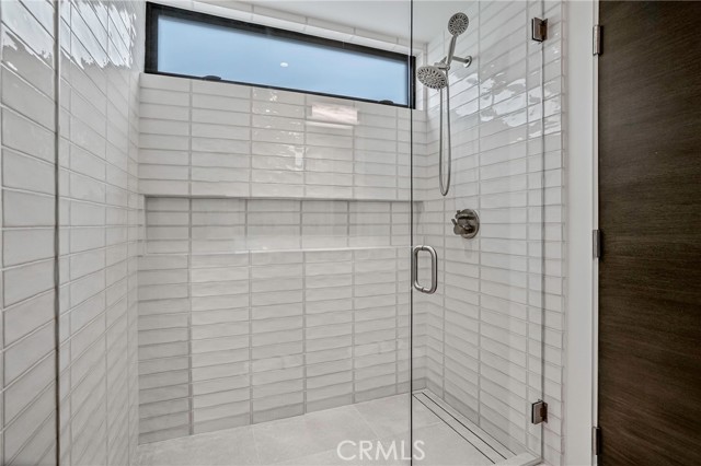 Walk-in shower in the en-suite bathroom. 3rd bedroom suite on 2nd level of home