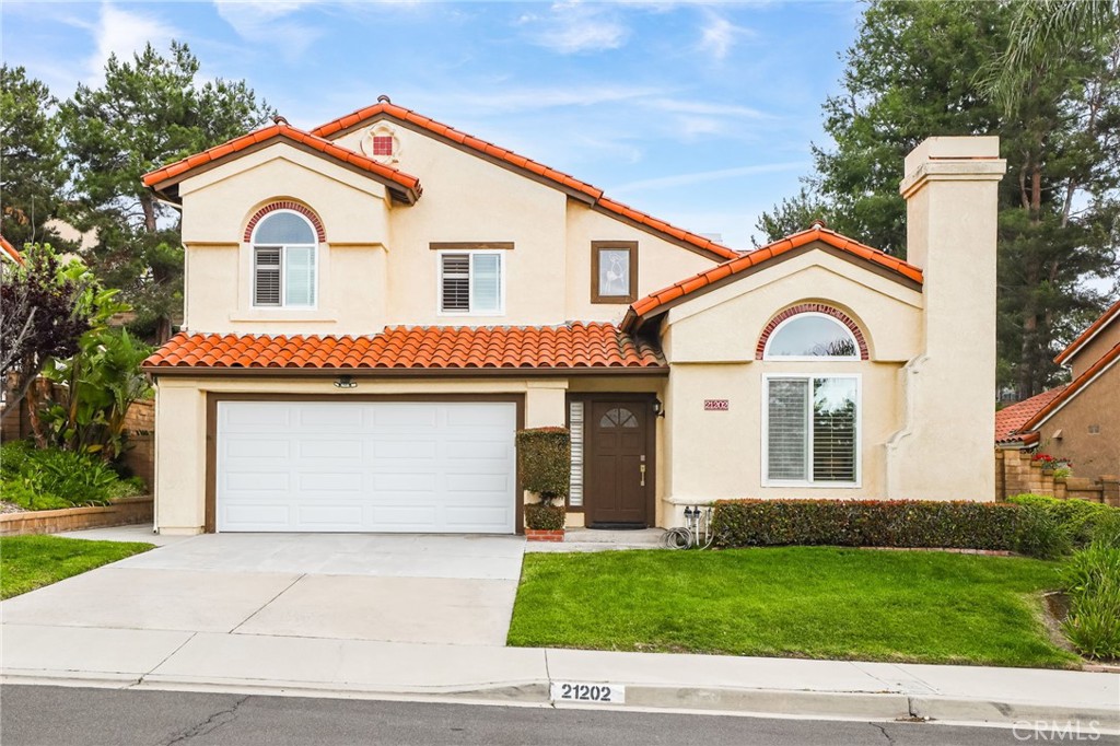 Nestled on a peaceful cul-de-sac, this beautifully upgraded home is filled with natural light and boasts a dramatic high-volume ceiling at the entry. Thoughtfully designed with exquisite finishes throughout, the home features energy-efficient vinyl windows, sliding patio doors, and custom plantation shutters. The gourmet kitchen is a chef’s dream, showcasing slate flooring, granite countertops with white stone backsplash, stainless steel Jenn-Air appliances, a Viking cooktop, Bosch dishwasher, repainted cabinetry, custom lighting, and a separate pantry. Enjoy multiple living areas, including a bright and airy living room with soaring ceilings and a white stone fireplace, and a spacious family room with a cozy travertine-faced fireplace. Both main floor and upstairs hallway bathrooms have been tastefully upgraded with granite countertops and elegant sinks. The expansive primary suite includes a large walk-in closet with mirrored doors and custom organizers, dual vanities, and access to a private balcony. Step outside to a serene backyard oasis featuring a spacious patio, wraparound lawn, multiple fruit trees, and a secondary patio area perfect for entertaining or relaxing. Located just minutes from the 241 toll road, top-rated schools, shops, parks, and fine dining—with access to all the resort-style amenities of Lake Mission Viejo. Don’t miss this incredible opportunity, this stunning home won’t last!