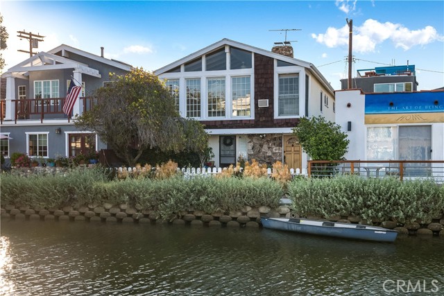This mesmerizing 2 bedroom unit sits on Carroll Canal, in Venice's renowned canal district -- the most charming, friendly, and funky spot in Los Angeles. The unit is within a 10-minute stroll to Venice’s world-famous beaches, the hopping Abbott Kinney, an Erewhon store, Main Street, and countless restaurants, bars, and food trucks. Be part of Venice’s funk, art, glamor, and exquisite cuisine. This rental provides many luxurious comforts with two fireplaces, central heating, and two AC units. The two bedrooms are separated by French doors and adorned with heavy curtains. The unit has two bathrooms (not adjoined to the bedrooms). Property comes furnished (all meticulously kept DWR furniture, not shown in photos). Rental offers 2 spaces for parking, one garage space, and a second spot in the driveway. The final photo (of the cute cottage with the palm tree) shows the view that you will be looking out onto as the sun rises and sets in beautiful Vencie beach.