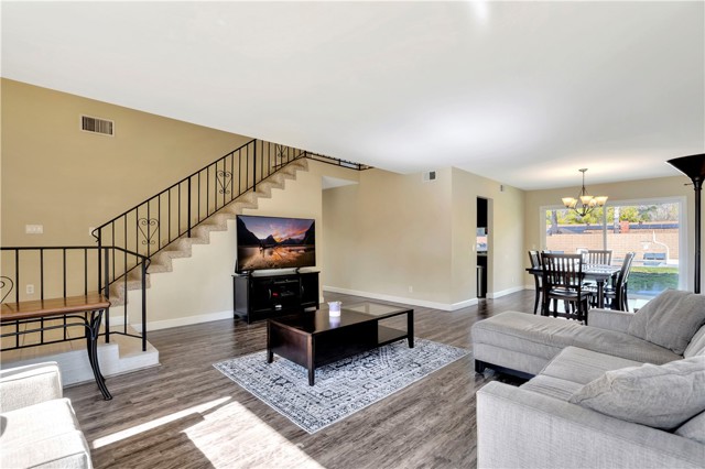 A large sliding glass door provides direct access to the backyard.